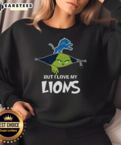 Alt Text: Awesome Grinch sweatshirt with 'I Hate People But I Love My Detroit Lions' design, perfect for Christmas fans.