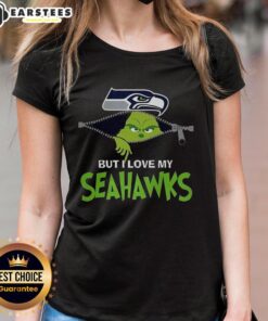 Alt Text: Ladies tee featuring 'I Hate People But I Love My Seattle Seahawks' design with Grinch graphic for Christmas.