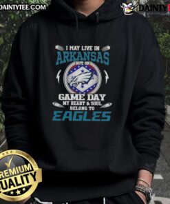 Person wearing an 'Awesome I May Live In Arkansas But On Game Day My Heart And Soul Belongs To Philadelphia Eagles Hoodie'