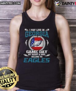 Alt Text: Woman wearing Philadelphia Eagles tank top, showcasing team pride despite living in Georgia on game day.