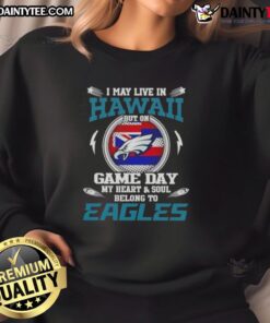 Cozy sweatshirt featuring 'I May Live In Hawaii But My Heart Belongs To Philadelphia Eagles' design for game day fans.