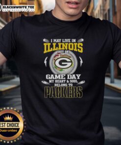 Green Bay Packers T-shirt with 'I May Live In Illinois But On Game Day My Heart Belongs To Packers' design.