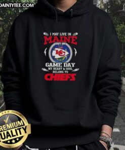 Person wearing a Kansas City Chiefs hoodie, showcasing team pride on game day in Maine, highlighting football fandom.