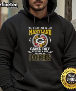 Maryland fan wearing a Green Bay Packers hoodie, showcasing team pride on game day with vibrant colors and spirited design.