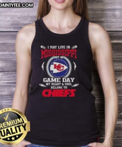 Alt Text: Woman wearing Kansas City Chiefs tank top, showing team spirit despite living in Mississippi on game day.