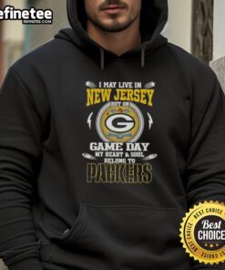 Person wearing a Green Bay Packers hoodie, showcasing pride on game day, despite living in New Jersey.
