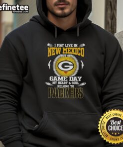 Alt Text: Fan wearing a Green Bay Packers hoodie, showcasing team pride while living in New Mexico on game day.
