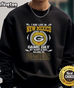Green Bay Packers sweatshirt featuring 'I may live in New Mexico, but my heart belongs to the Packers' text design.