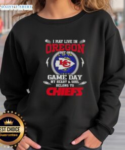 Kansas City Chiefs sweatshirt with 'I may live in Oregon but my heart belongs to KC' design, perfect for game day.