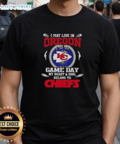Awesome t-shirt featuring 'I May Live In Oregon But My Heart Belongs To Kansas City Chiefs' for NFL fans.