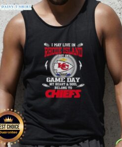 Cheerful fan wearing a Kansas City Chiefs tank top, showcasing pride while living in Rhode Island on game day.