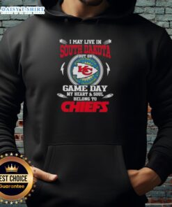 Fan wearing a Kansas City Chiefs hoodie, showing team spirit in South Dakota on game day.