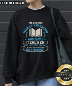 Alt Text: Proud mom wearing a sweatshirt that says I'm a Proud Mom of a Freaking Awesome Teacher with a joyful expression.