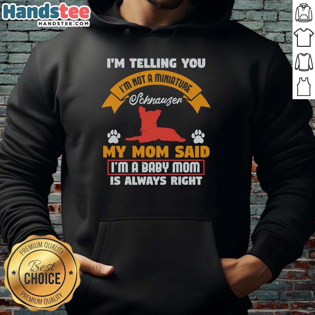 awesome-im-telling-you-im-not-a-miniature-schnauzer-my-mom-said-im-a-baby-mom-hoodie Adorable baby in a hoodie with the phrase I'm Not A Miniature Schnauzer showcasing playful pet humor and style.