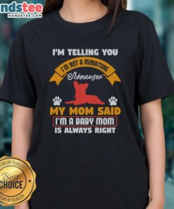 Funny baby t-shirt featuring a Schnauzer dog with the text 'Not a Miniature Schnauzer, I'm a Baby Mom!' for pet lovers.