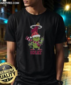 Awesome Miami Heat Christmas Grinch Santa Hat Holiday 2025 T-Shirt featuring festive design for NBA fans.