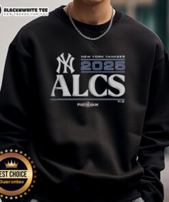 Alt Text: New York Yankees 2025 Division Series Winner sweatshirt displayed in the locker room, showcasing team pride and style.