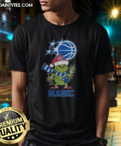 Orlando Magic Christmas Grinch Santa Hat T-Shirt for 2025 holiday season, featuring vibrant colors and festive design.