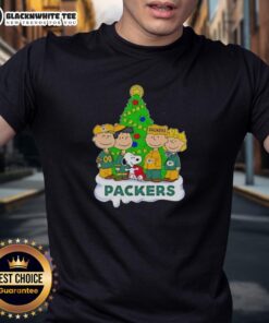 Awesome Peanuts characters on a Green Bay Packers Christmas T-shirt, perfect for fans celebrating the holiday season.