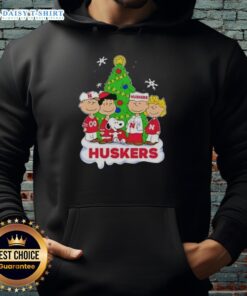 Awesome Peanuts characters Christmas hoodie featuring Nebraska Cornhuskers logo, perfect for festive fans.