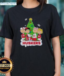 Awesome Peanuts characters on a Nebraska Cornhuskers Christmas ladies tee, perfect for holiday cheer and fan style.