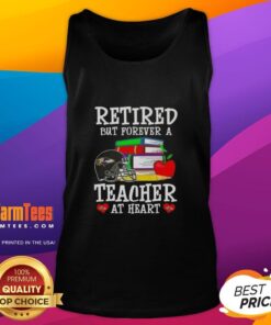Awesome retired but forever a teacher at heart Baltimore Ravens football tank top displayed on a mannequin.