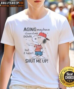 Alt Text: Awesome Snoopy Aging May Have Slowed Me Down But It Hasn'T Shut Me Up T-Shirt featuring Snoopy design.