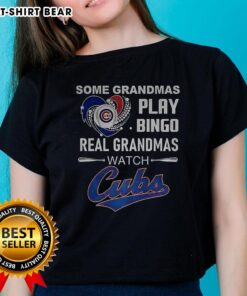 Grandmas enjoying bingo while wearing Chicago Cubs baseball tees, showcasing love for the game and fun activities.