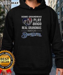 Real grandmas enjoy bingo while wearing Milwaukee Brewers baseball hoodies at the diamond, showcasing their love for the game.