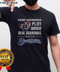 Grandma wearing a 'Real Grandmas Watch Milwaukee Brewers' T-shirt while playing bingo at a baseball diamond.