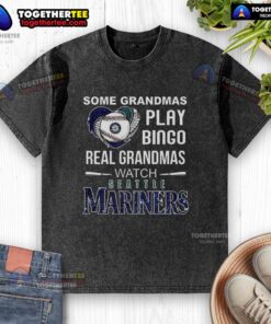 Real grandmas playing bingo in Seattle Mariners baseball t-shirts, showcasing fun and community spirit.