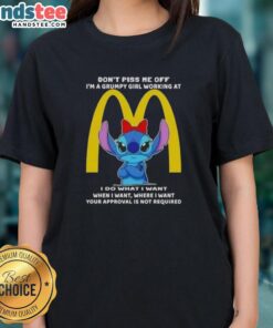 Grumpy girl in McDonald's uniform wearing 'Don't Piss Me Off' tee, showcasing Awesome Stitch design for ladies.