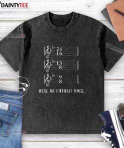 Humorous washed t-shirt featuring music notes, perfect for navigating these difficult times with a smile.