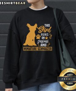 Alt Text: Girl wearing 'Awesome - This Girl Runs on Jesus and Miniature Schnauzer' sweatshirt, smiling with her Miniature Schnauzer.