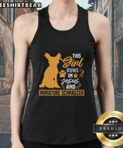 Girl wearing 'This Girl Runs On Jesus And Miniature Schnauzer' tank top, smiling outdoors with her schnauzer dog.