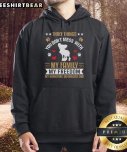 Awesome hoodie featuring the quote 'Three Things You Dont Mess With: My Family, My Freedom, My Miniature Schnauzer.'