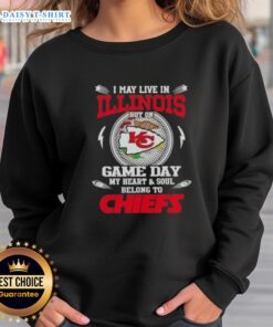 Kansas City Chiefs sweatshirt: A fan proudly displays team spirit, highlighting loyalty despite living in Illinois.
