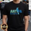 Alt Text: Cute Antifa 'Only A Fascist Would Demonize Anti-Fascism' T-Shirt showcasing a bold anti-fascism message.