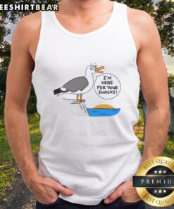 Cute Beach I'm Here for Your Snacks tank top worn by a smiling woman on a sunny beach day.