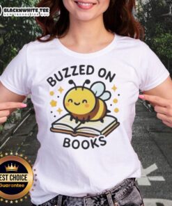 Cute bee buzzing on a stack of books on a ladies tee, perfect for book lovers and bee enthusiasts.