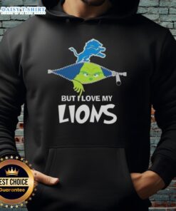 Cute Grinch wearing a Detroit Lions football hoodie, showcasing holiday spirit and team pride in a festive setting.