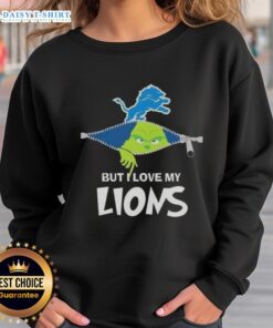 Cute Grinch wearing a Detroit Lions football sweatshirt, showcasing holiday spirit and team pride.
