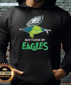 Cute Grinch wearing a Philadelphia Eagles hoodie, showcasing team spirit and holiday cheer in a fun, festive style.