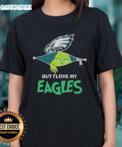 Alt Text: Cute Grinch graphic on a ladies tee, showcasing love for Philadelphia Eagles football in festive colors.