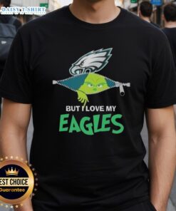 Cute Grinch wearing a Philadelphia Eagles football T-shirt, showcasing holiday spirit and team pride.