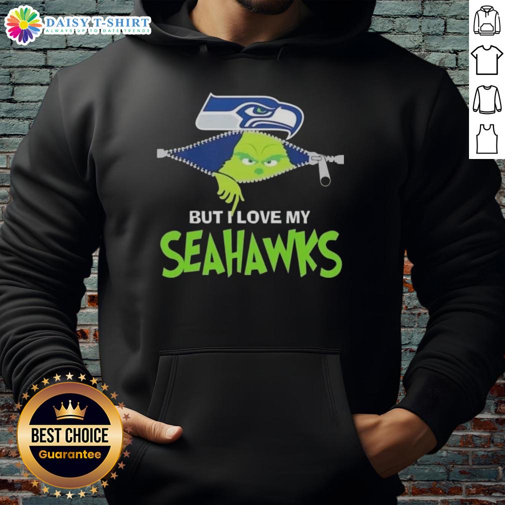Cute Grinch But I Love My Seattle Seahawks Football Hoodie Alt Text: Adorable Grinch wearing a Seattle Seahawks football hoodie, showcasing team spirit and festive cheer.