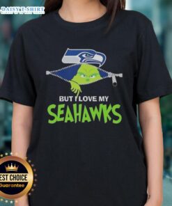 Alt Text: Cute Grinch graphic on a Seattle Seahawks football ladies tee, perfect for fans celebrating the holiday season.