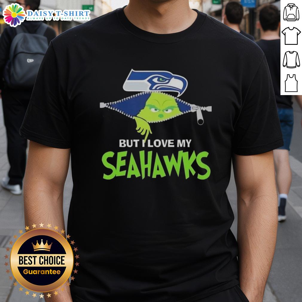 Cute Grinch But I Love My Seattle Seahawks Football T Shirt Alt Text: Cute Grinch wearing a Seattle Seahawks football T-shirt, showcasing team spirit and holiday cheer in a playful design.
