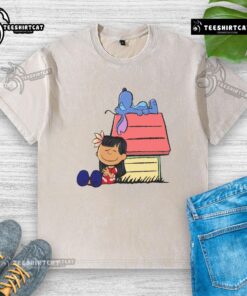 Cute Peanuts Snoopy X Stitch t-shirt featuring 'It Means Nobody Gets Left Behind' design, perfect for casual wear.