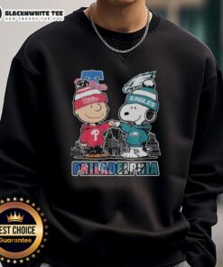 Alt Text: Cute Philadelphia Phillies and Eagles 75th Anniversary Peanuts Snoopy sweatshirt featuring vibrant team colors and graphics.